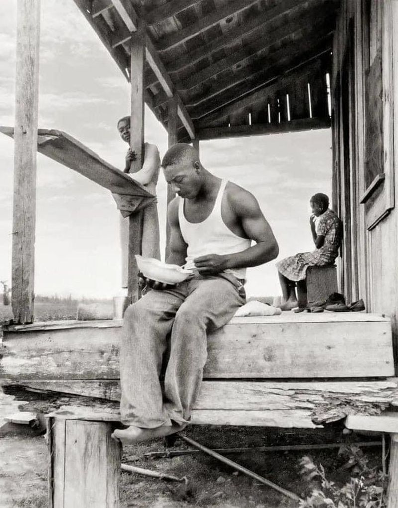 A sharecropper grabbing a bite in Clarksdale, Mississippi in 1937